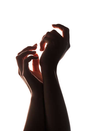 Hands silhouette. Social pressure. Tired woman arms isolated on white copy space background. Female strength. Freedom independence. Hope effort.の写真素材