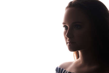 Confident lady face silhouette isolated on white copy space background.の写真素材