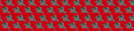 Red Christmas background. Fir tree seamless pattern. New Year decorative composition. Blue spruce sprig arrangement isolated on bright color surface.の写真素材