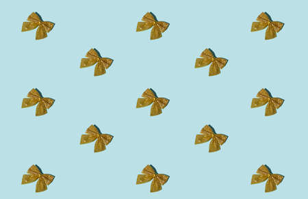 Blue Xmas background. Seamless pattern. Gold glitter bow. New Year party decor. Minimalist glamour...