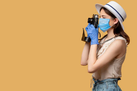 Travel photo. Covid-19 restriction. Capture holiday memories. Stay safe. Woman in protective mask...