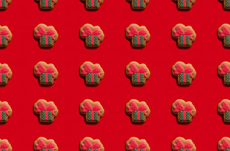 Red seamless background. New Year celebration creative adornment. Green abstract gift box festive...