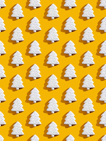 White Xmas tree pattern. Orange seamless background. Festive art ornament composition. Winter...