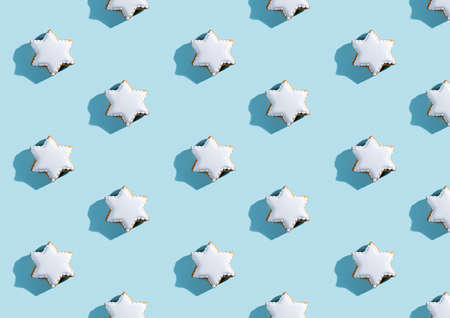 Bakery star pattern. Christmas traditional cookies. Festive winter decor. Gingerbread biscuits with...