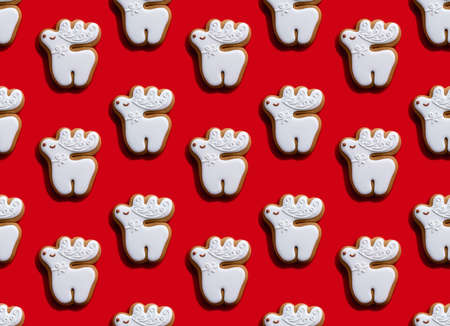 Red seamless background. White cute deer pattern. Minimalist symmetrical composition wallpaper for...