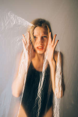 Woman protection. Defocused portrait. Female rights. Social isolation. Scared insecure lady looking...