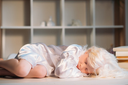 Sleeping kid. Carefree childhood. Dream lullaby. Peaceful tired adorable sweet blonde little girl in...