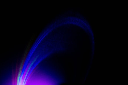 Fluorescent background. UV radiance. Defocused colorful blue purple magenta pink neon light glowing...