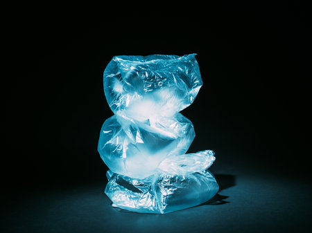 Pollution art. Zero waste. Garbage management. Ecology problem. Blue wrinkled used cellophane bags...