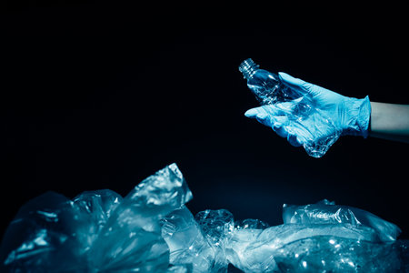 Waste management. Plastic recycling. Ecology problem. Environmental protection. Volunteer hand in...