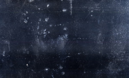 Dust overlay. Weathered blackboard. Dark stained grunge texture distressed old surface with scratches grainy noise effect for photo editor.の写真素材