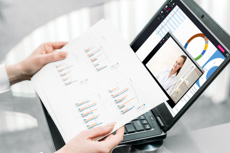 Video conference. Online meeting. Distant work. Virtual office. Female partners discussing project...