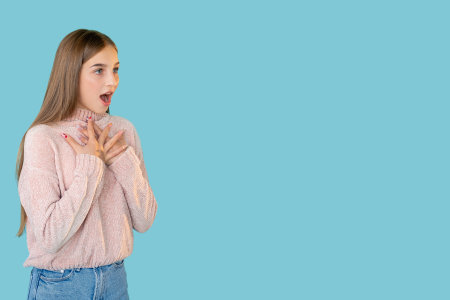 Amazed teen girl. Promotional background. Amazing opportunity. Omg really. Portrait of happy stunned...