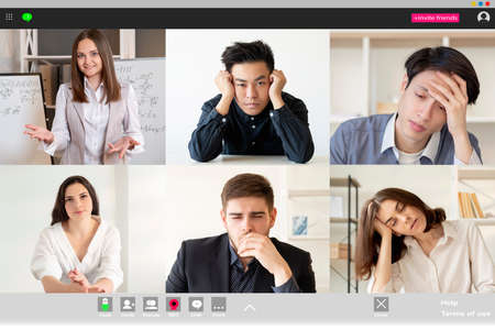 Remote learning. Video lesson. Online education. Distance communication. Exhausted bored diverse multiethnic group of students sleeping listening to female teacher at digital class on screen.の写真素材