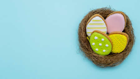 Easter holiday. Festive food decor. Sweet homemade ornament. Colorful composition of green yellow...