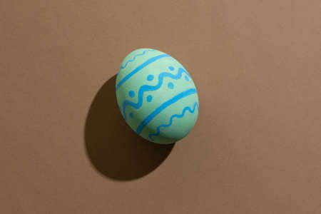 Easter egg. Festive decoration. Spring holiday. Gift card. Colorful light green paschal symbol with...