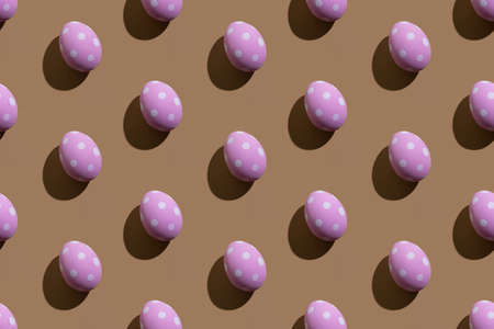 Easter pattern. Seamless banner. Holiday design. Festive art. Abstract background. Pink eggs with white spotted ornament isolated on beige.の写真素材