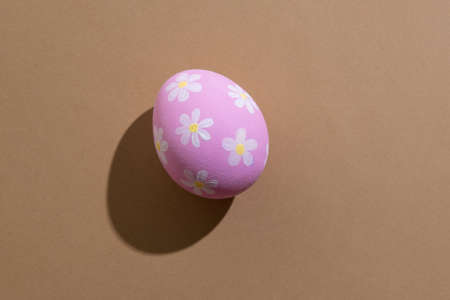 Pretty easter egg. Festive gift card. Spring holiday decoration. Abstract background. Pink paschal...