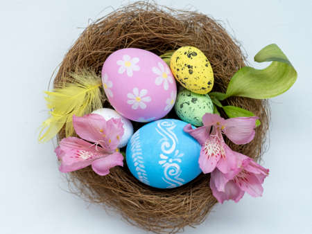 Happy Easter. Holiday composition. Handmade natural decoration. Pastel color painted quail chicken...