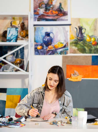 Creative lifestyle. Art inspiration. Painting hobby. Inspired woman artist enjoying drawing with...