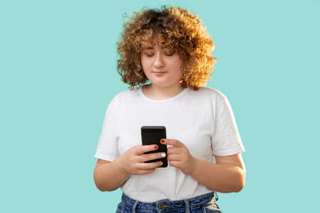Gadget people. Phone communication. Body positive. Modern technology. Happy cheerful smiling curly...