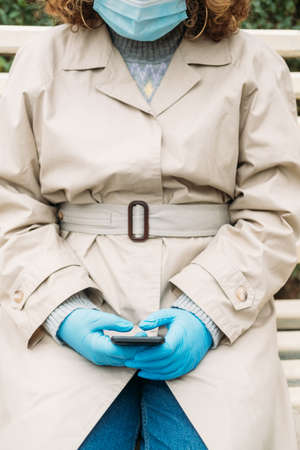 Vaccine certificate app. Mobile healthcare. Immunity passport. Unrecognizable woman outdoors in...