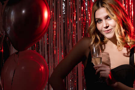 Birthday woman. Festive party. Holiday celebration. Pretty happy elegant lady black dress posing...