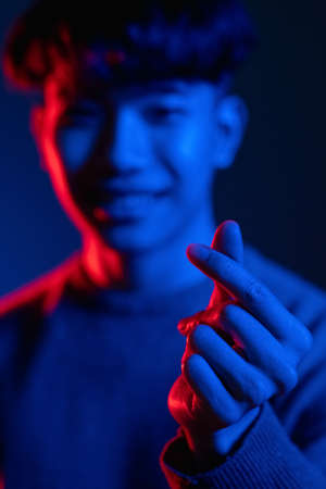 korean love sign admiration gesture man hand neonの写真素材