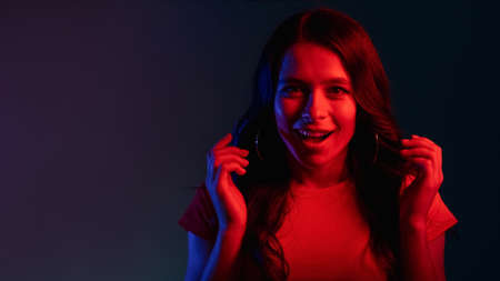 amazed woman wow reaction woman red neon lightの写真素材