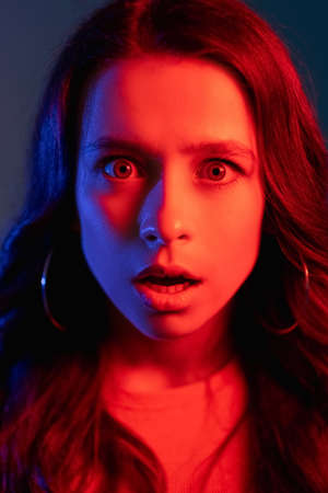 omg reaction cyberpunk portrait woman neon lightの写真素材