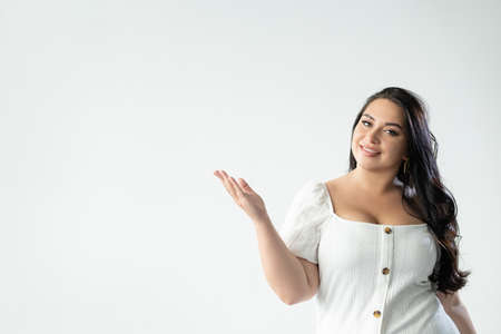 advertising woman welcome gesture importantの写真素材