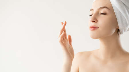 Wrinkle treatment. Inspired woman. Rejuvenation cosmetology. Advertising background. Pretty lady enjoying life isolated white copy space.の写真素材