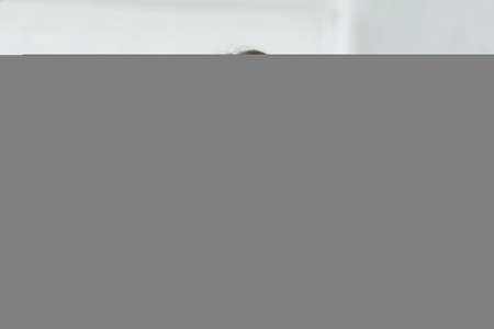 Patches treatment. Facial skincare. Aesthetic cosmetology. Thoughtful pondering woman with under eye pads on flawless fresh face skin at bathroom.の写真素材