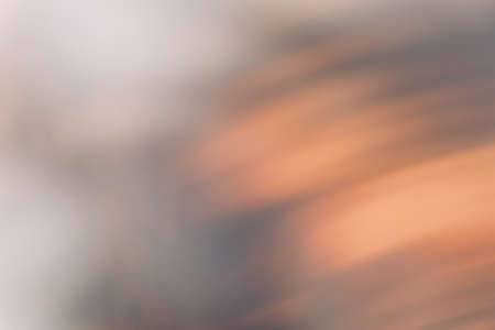 Defocused glow overlay. Light flare. Bokeh optical radiance. Sunlight reflection. Blur orange white black color rays spot abstract background.の写真素材