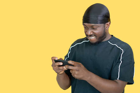Online scrolling. Rapper man. Mobile technology. Happy hipster guy messaging in smartphone isolated...
