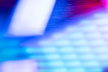 Blur led light. Fluorescent background. Ultraviolet radiance. Defocused neon blue white red pink...
