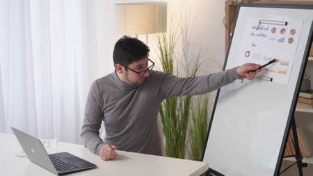 Statistics presentation. Data analytics. Business webinar. Cheerful excited man analyzing financial...