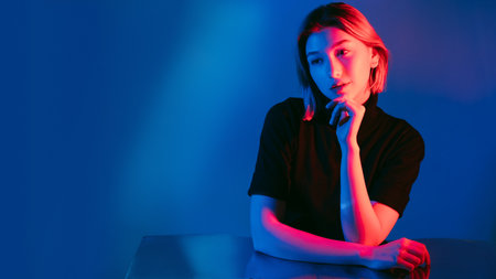 Pensive woman. Neon light banner. Tenderness melancholy. Portrait of relaxed thoughtful girl in pink...