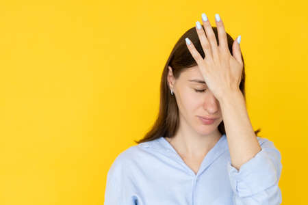 Facepalm gesture. Shocked woman. Epic fail. Pretty expressive lady holding hand on forehead isolated...