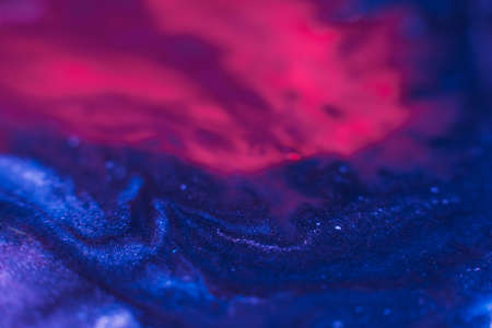 Paints blend. Abstract background design. Blue pink inks mix
