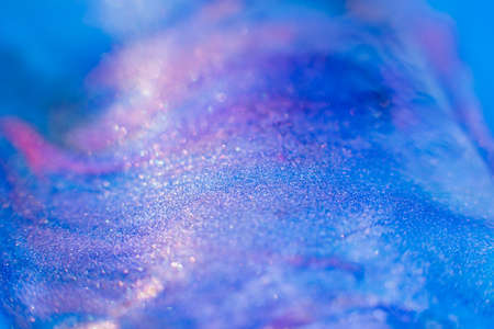 Mixed paints art. Abstract design background. Blue purple pink glitter ink blendの写真素材