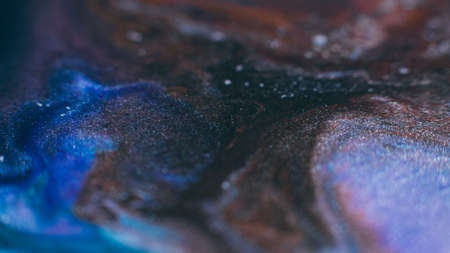 Ink blend. Artistic hobby. Colorful abstract bakgrund. Purple blue glitter paints mixの写真素材