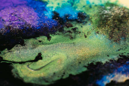 Fluid inks. Multicolor artistic background. Purple green paints mixの写真素材