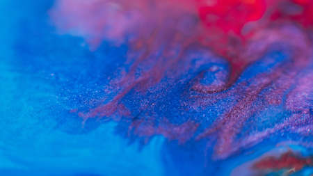 Fluid inks. Multicolor artistic background. Purple blue pink paints mix