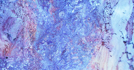 Glitter ink background. Dye mix. Snow frost. Sparkling stone surface. Defocused blue pink color...