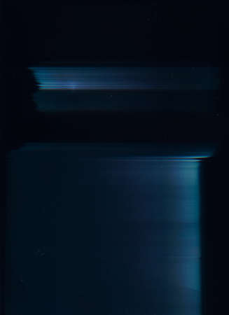 Noise overlay. Analog glitch texture. Screen defect. Weathered mask. Blue color defocused glow artifacts dust scratches on dark black abstract background.の写真素材