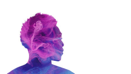 Aura energy. Inner harmony. Spiritual contemplation. Double exposure profile silhouette of man face with purple blue pink color smoke isolated on white copy space.の写真素材