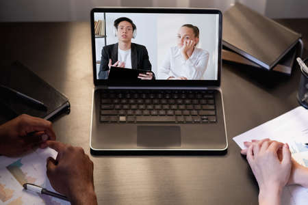 Video interview. Remote meeting. International teleconference. Tired diverse business colleagues...