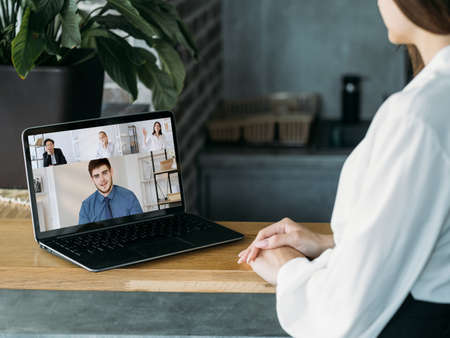Web chat. Coworkers network. Internet interview. Diverse business colleagues discussing project working online in digital office on laptop screen.の写真素材