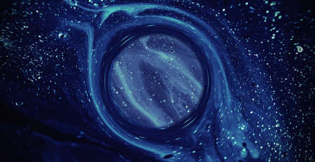 Glitter ink background. Paint mix. Shimmering liquid leak round circle. Blur blue purple pink shiny wet fluid flow motion. Abstract texture shot on RED Cinema camera.の写真素材